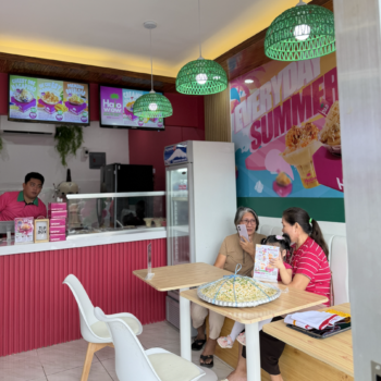 Families and friends enjoying Halo-Halo together inside a Halowow store celebrating Filipino dessert tradition