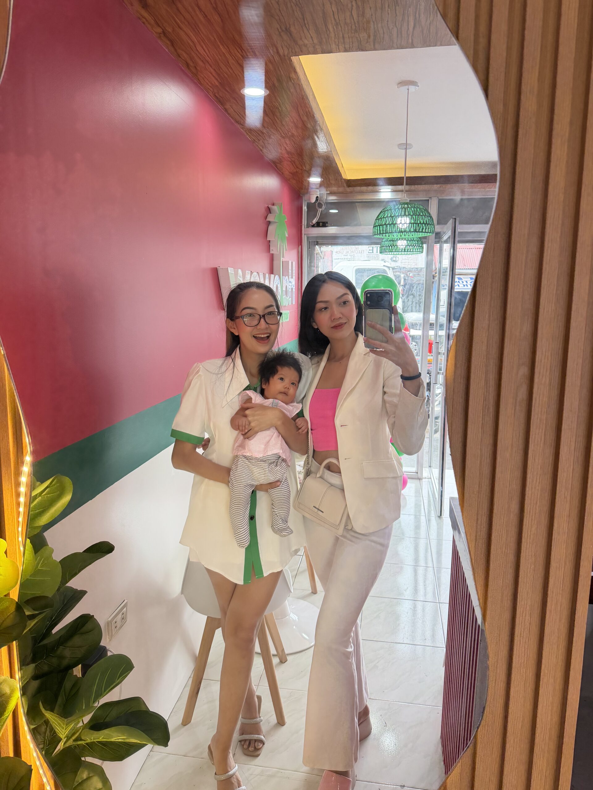 Halowow founders the Maghinay sisters with their baby inside the Halowow halo-halo dessert shop in the Philippines