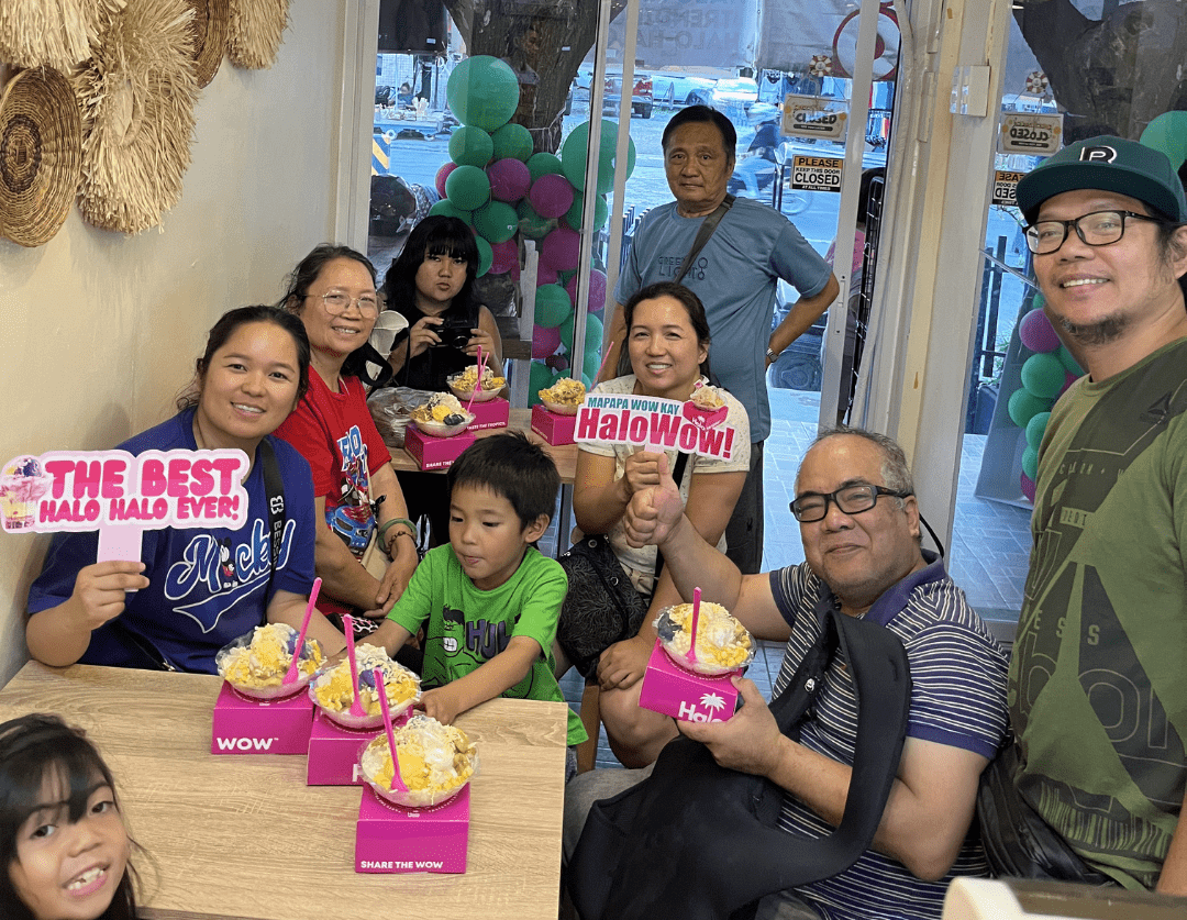 Happy family enjoying Halowow halo-halo desserts together in a vibrant and welcoming setting.